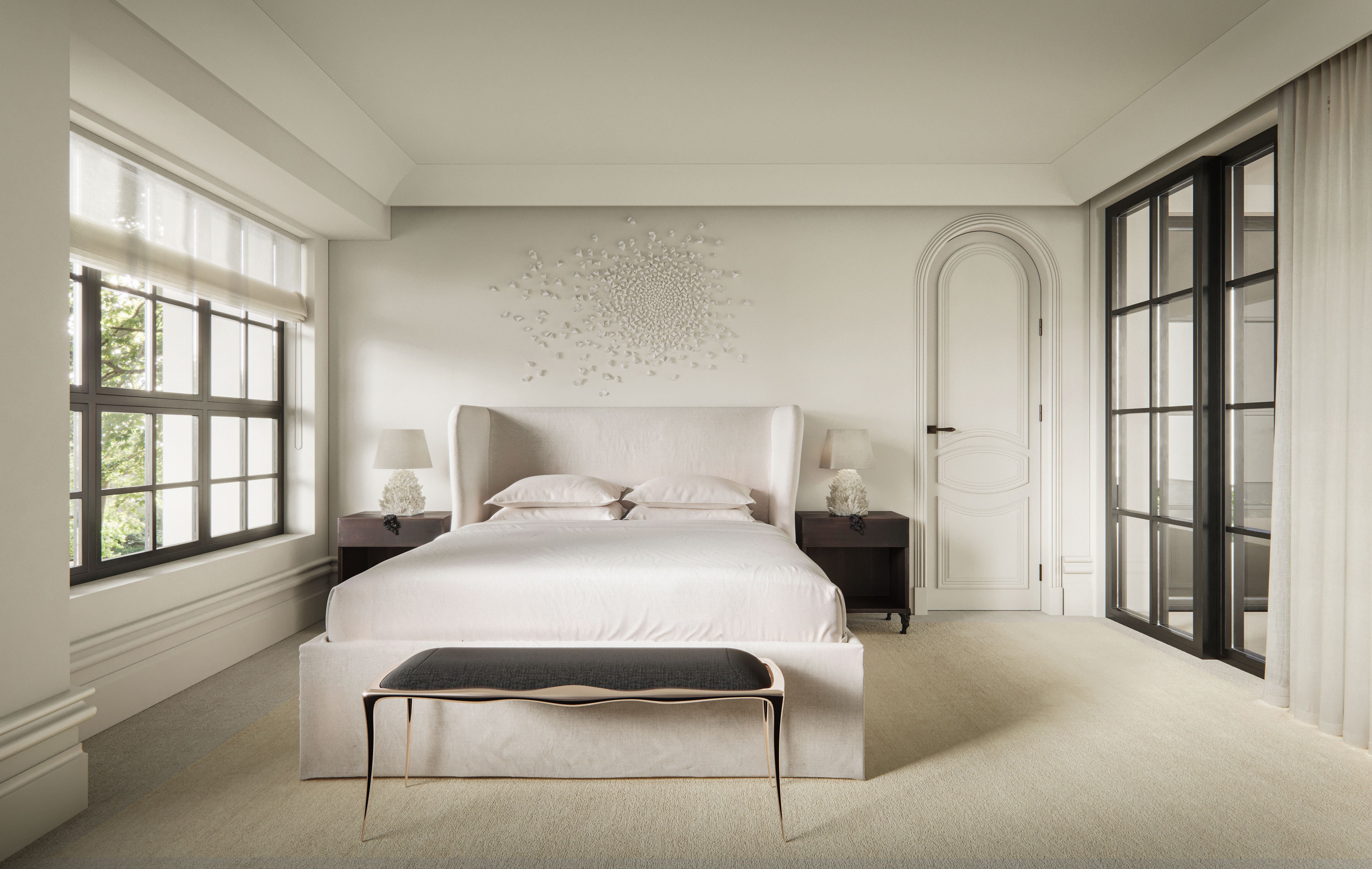 Serene white bedroom by Freeman & Co with an upholstered bed and arched doorway