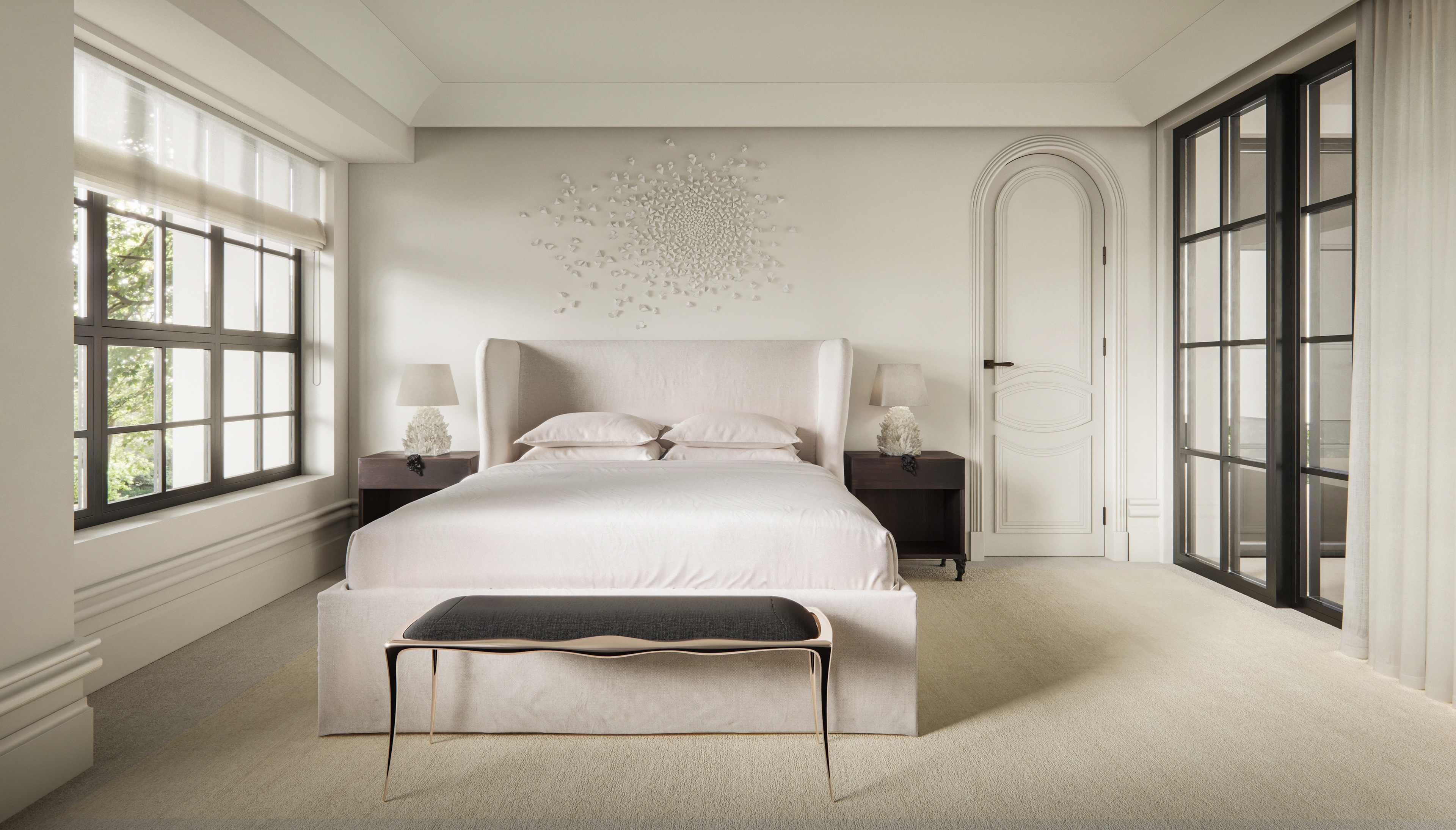 Serene white bedroom by Freeman & Co with an upholstered bed and arched doorway