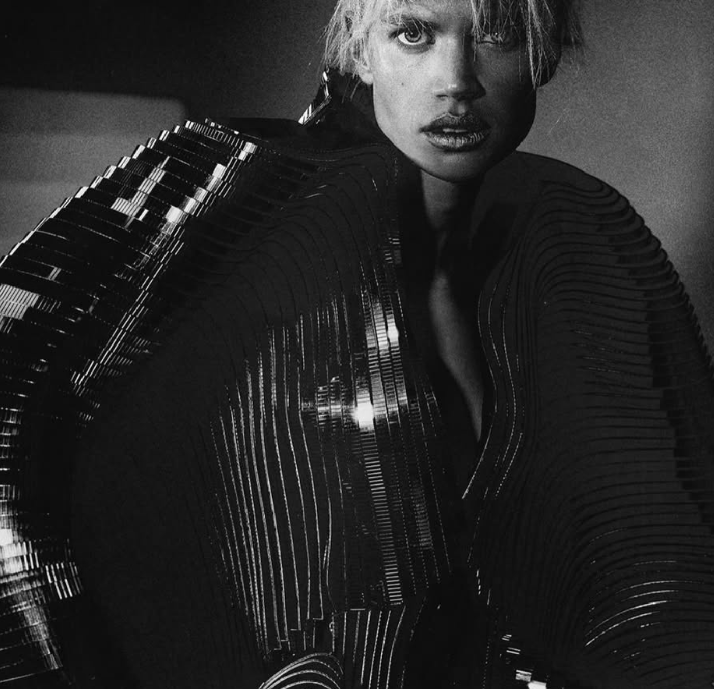 Numéro magazine cover showing a model in a shimmering black sculptural gown