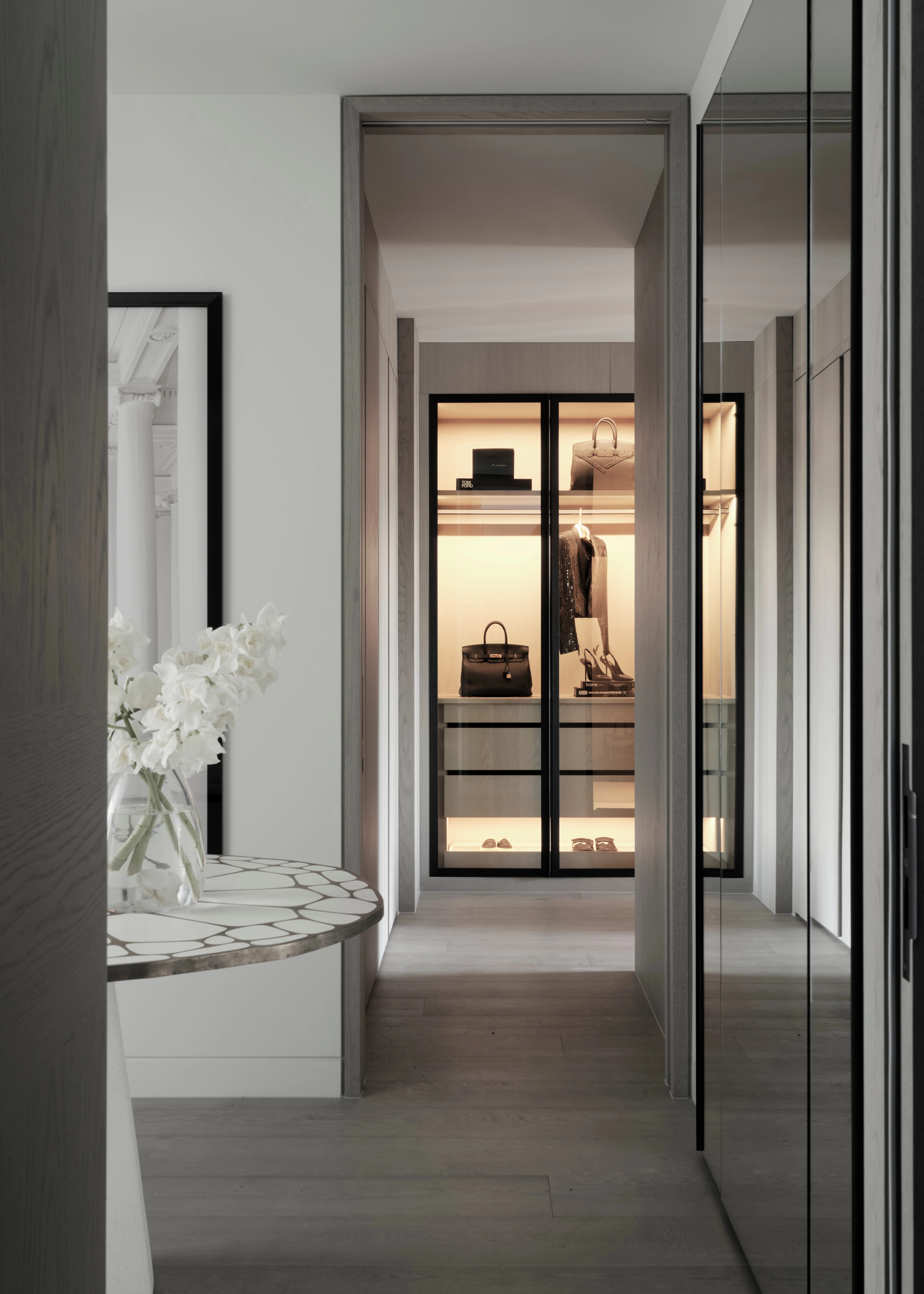 Entry hall opening to a lit dressing room at The Rocks residence by Freeman & Co