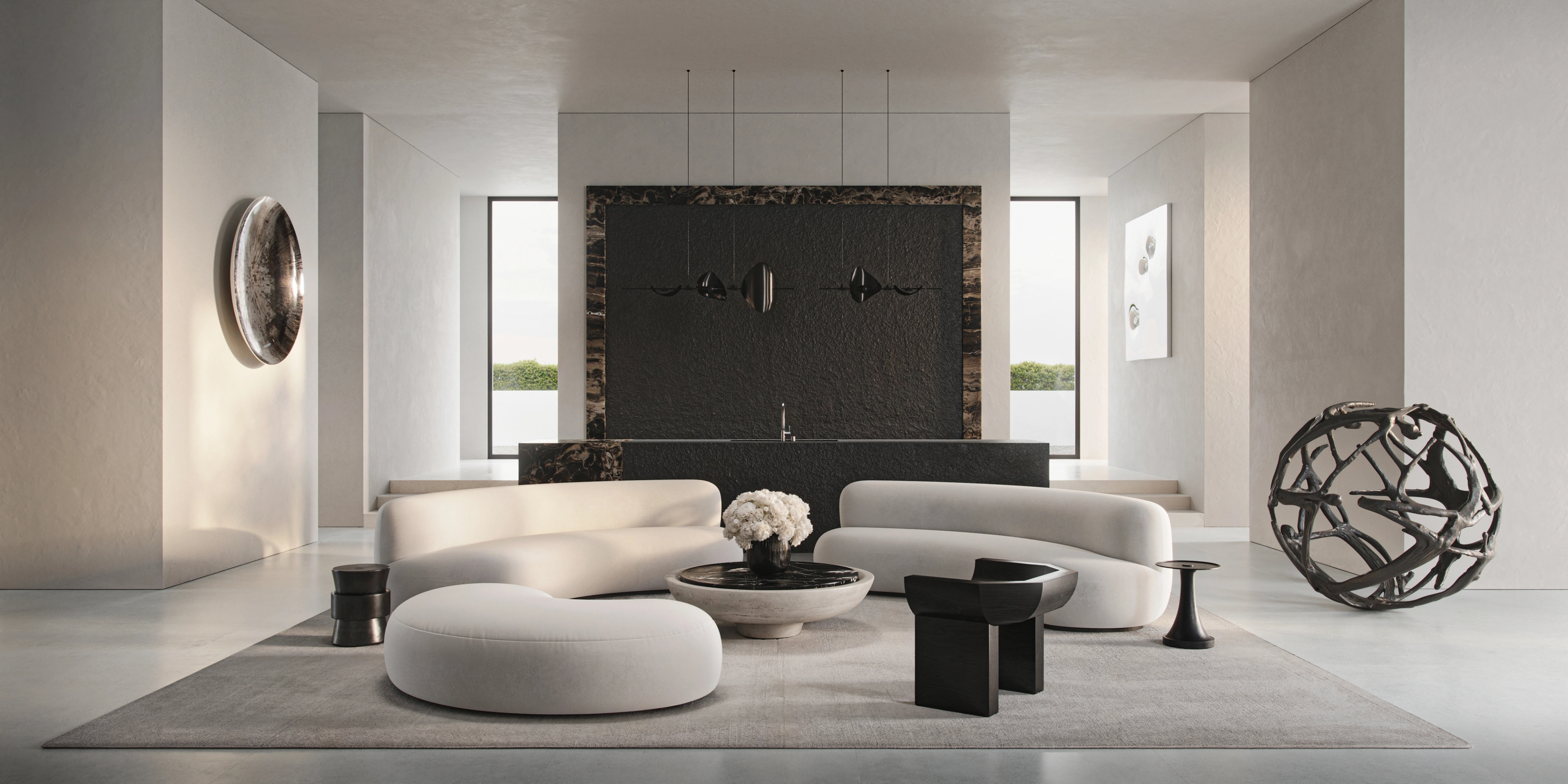 Curved lounges and sculptural bronze sphere in the South Coast living room