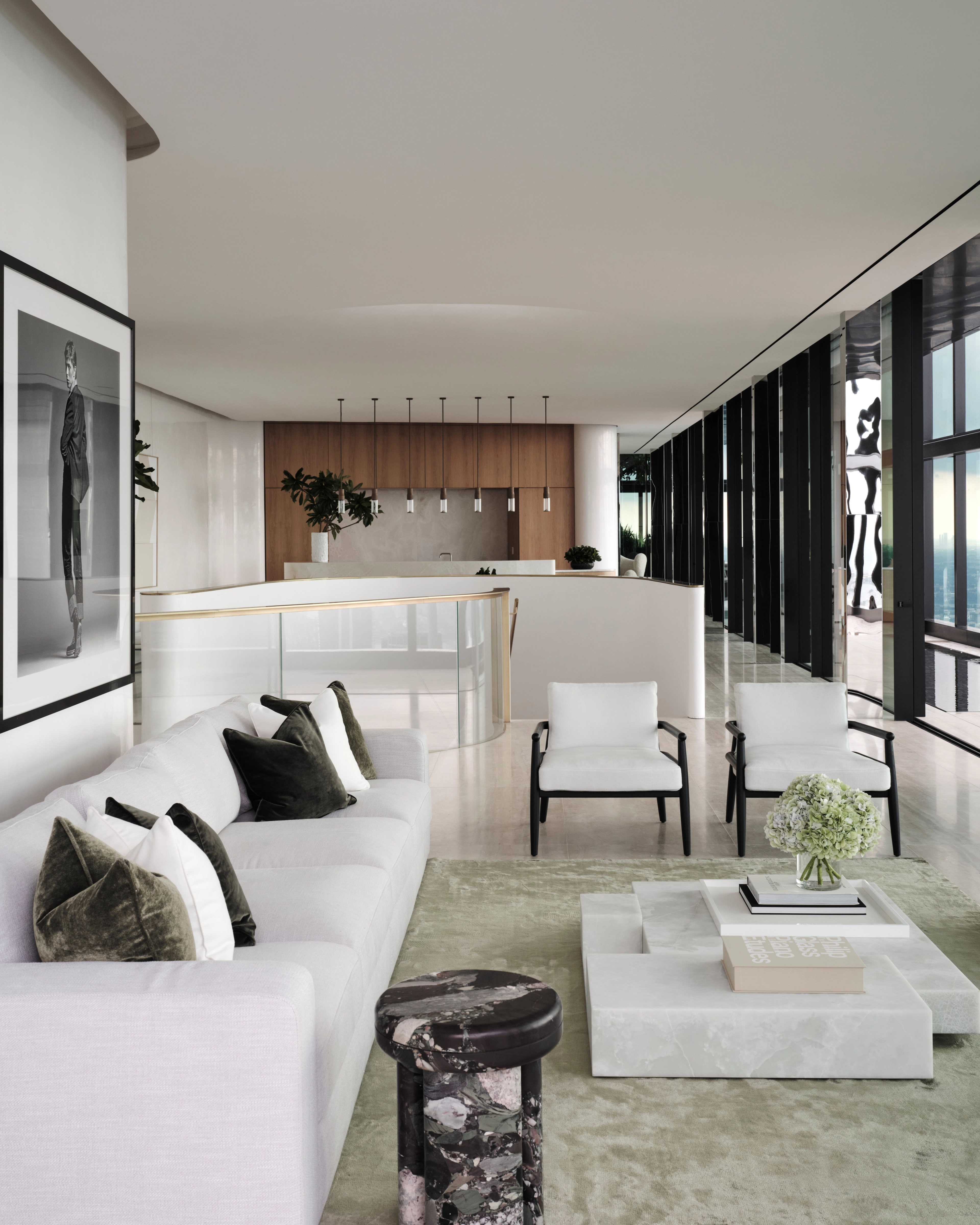 Airy Sydney CBD living space with white sofas, layered artwork and a sweeping city outlook