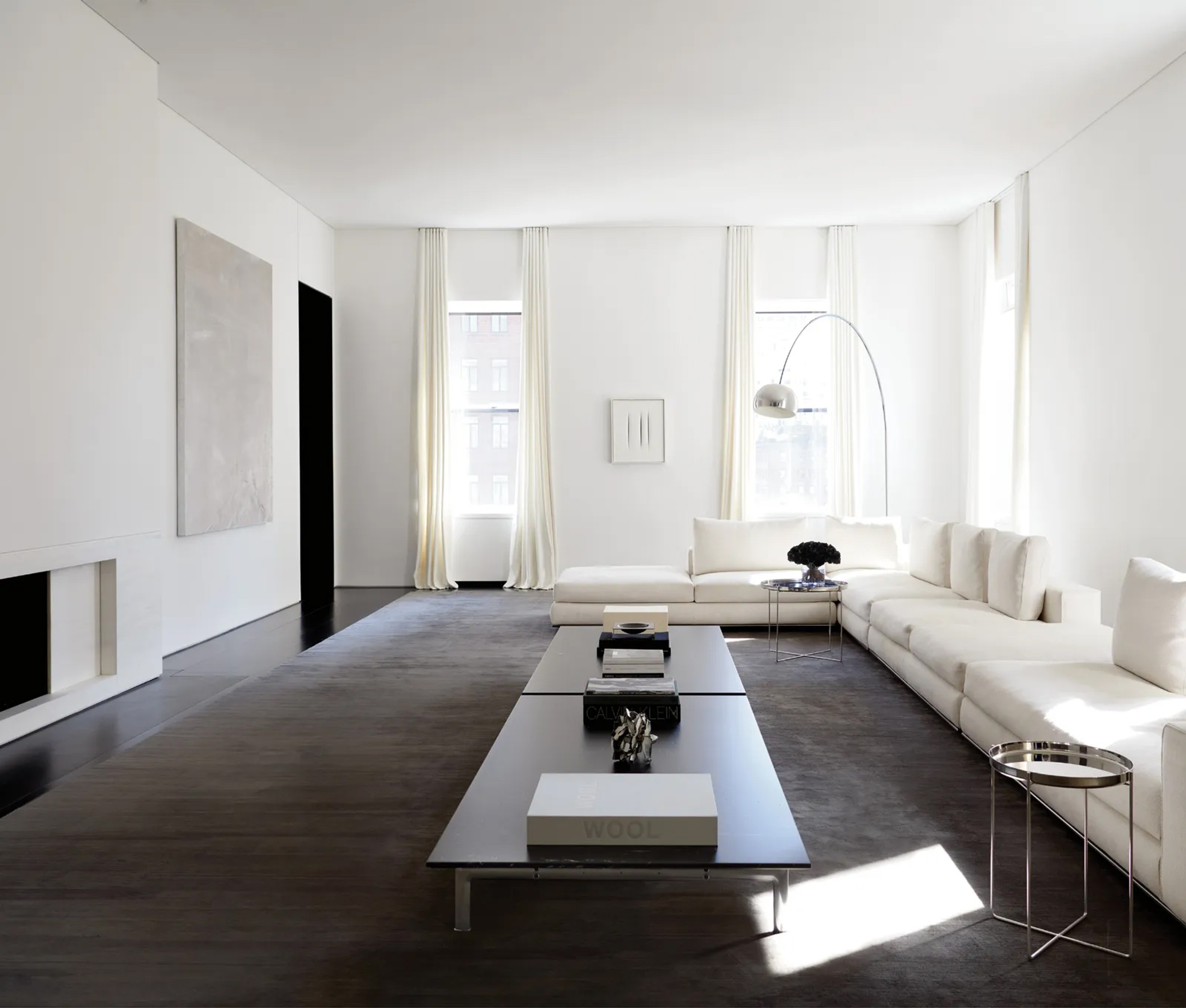 Expansive Sydney CBD lounge with a sectional sofa and floor-to-ceiling windows