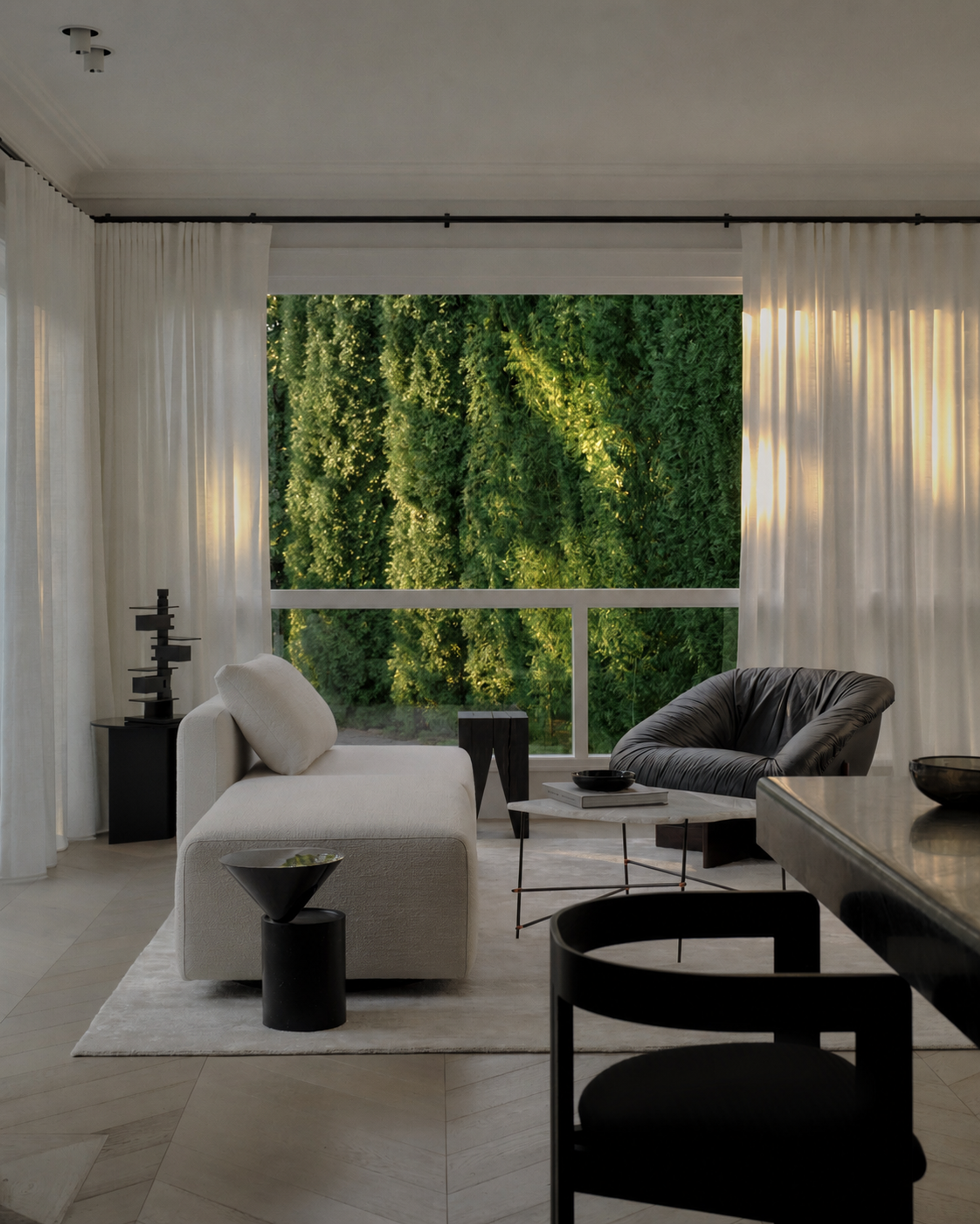 Vaucluse living room framing a lush vertical garden through the window behind a cream sofa