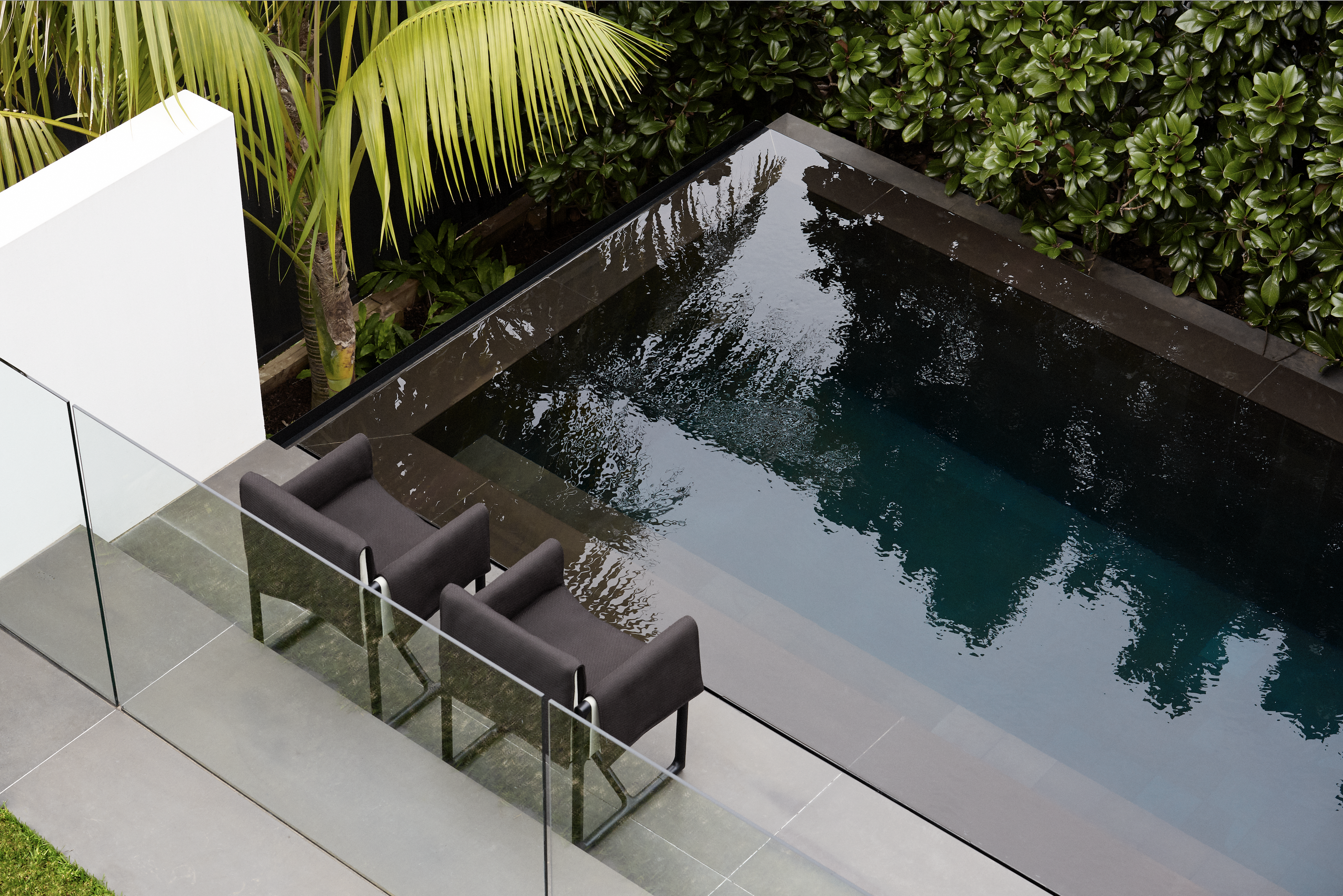 Monochrome sitting room with sculptural black armchair and abstract line artwork, Balmoral Beach
