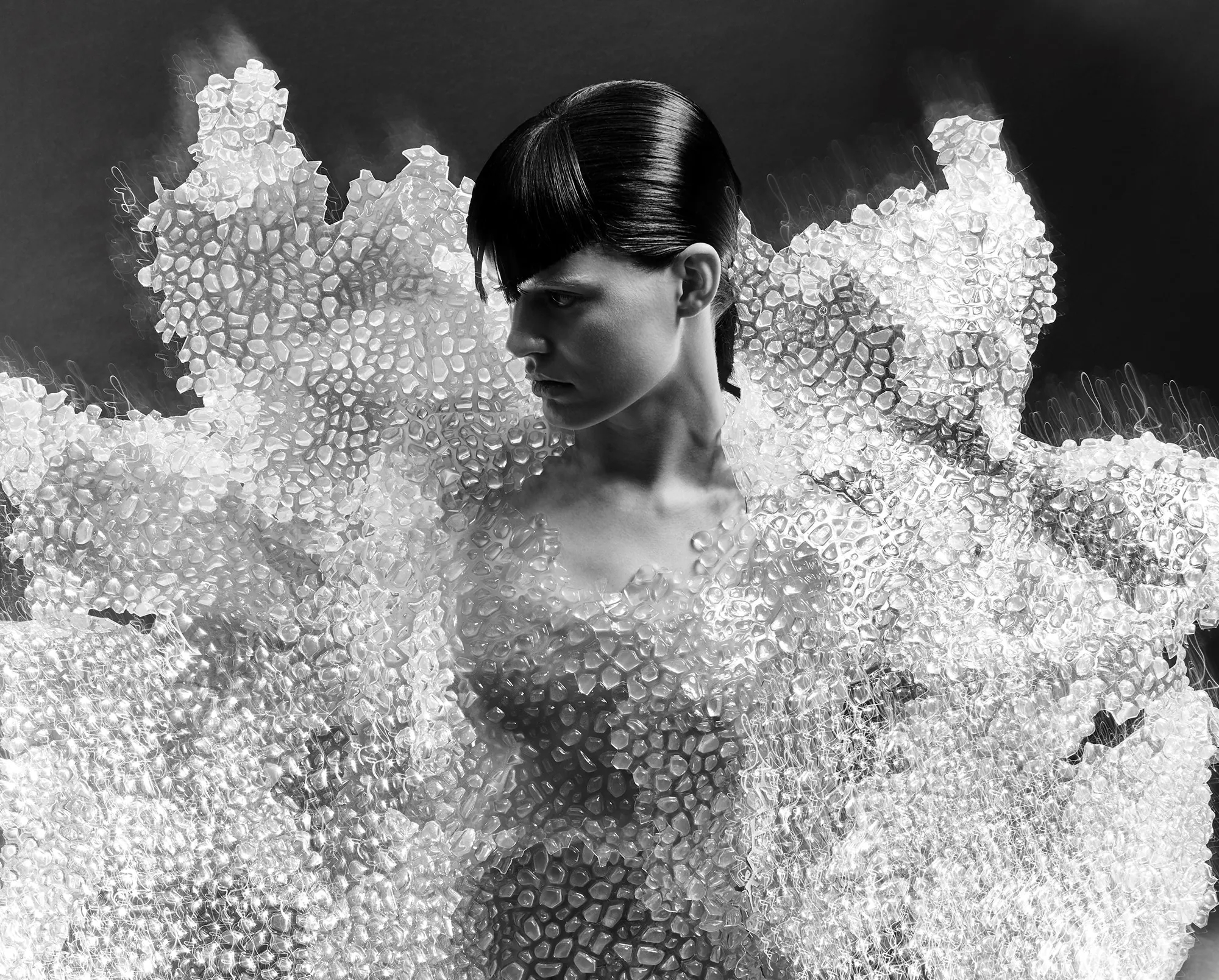Model wearing an intricate coral-like couture gown by designer Iris van Herpen